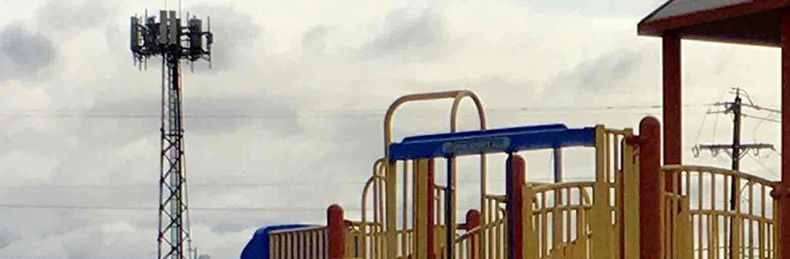 children play area with cell looming tower